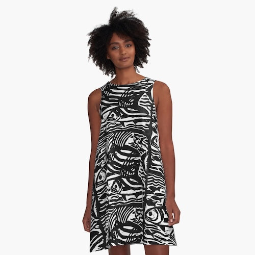Woman wearing a black and white patterned dress on a white background